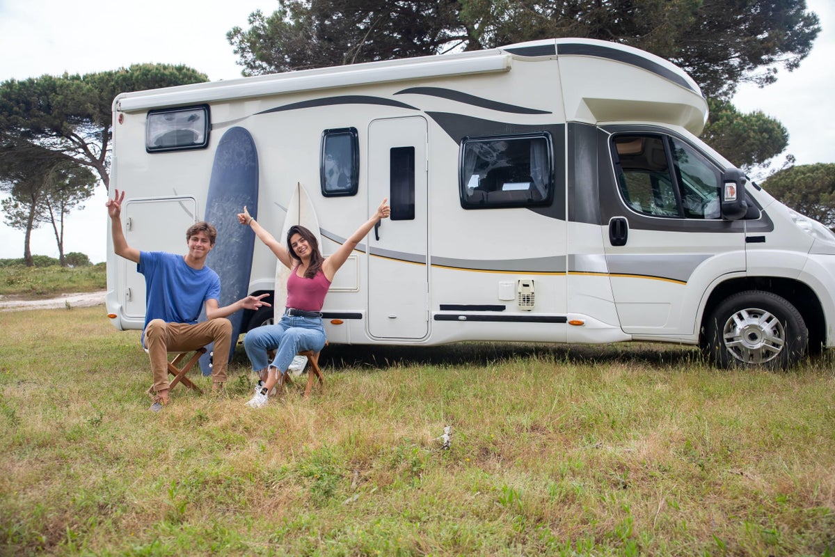 Couple sat outside their caravans