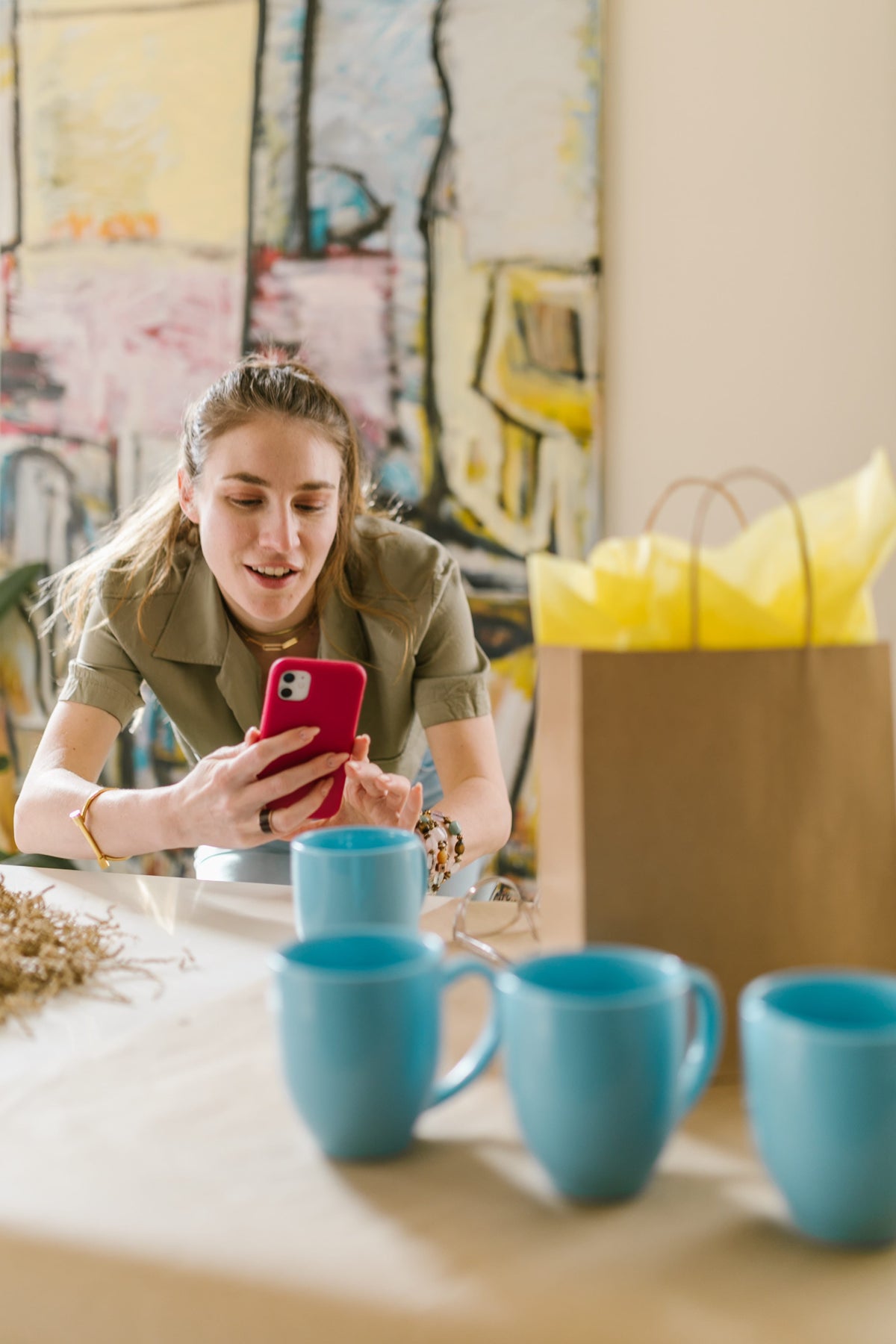 Women photographing items to sell