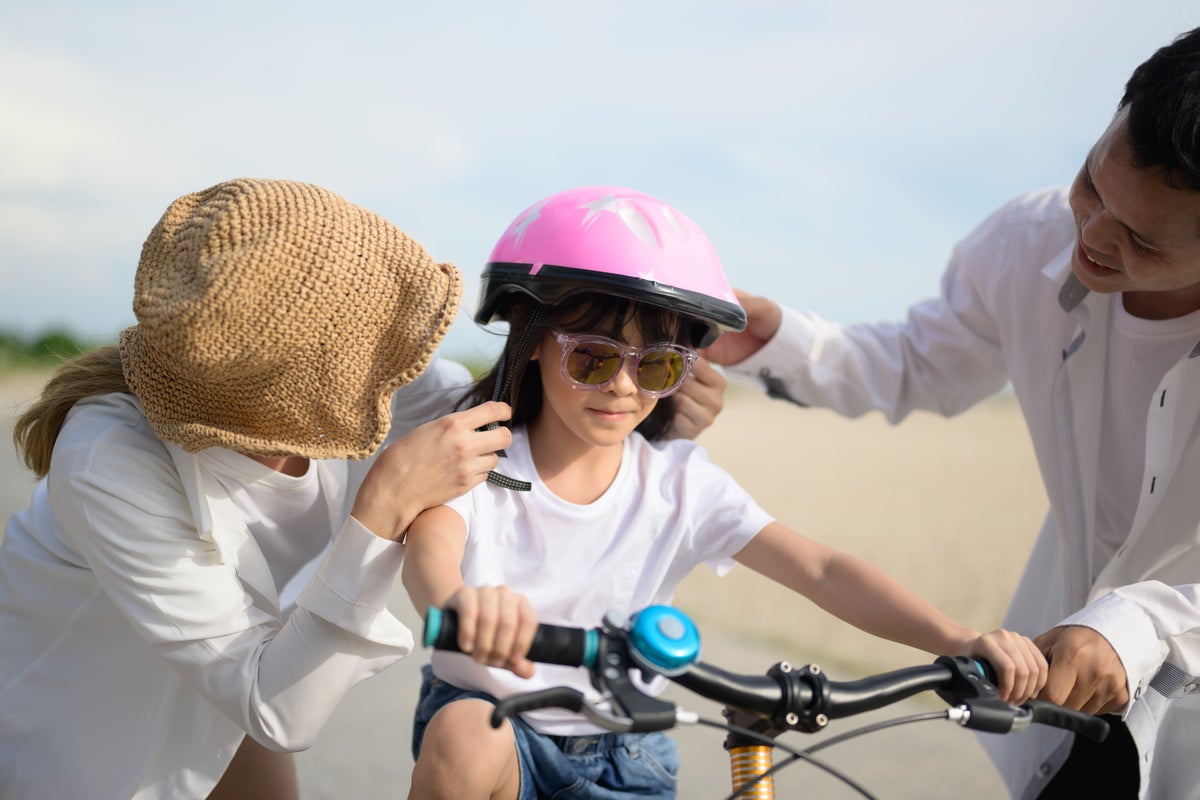 kid riding bike summer